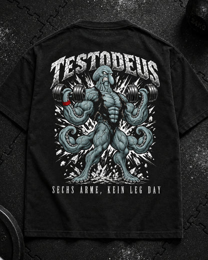 TESTODEUS Oversized Shirt schwarz - Flat-Lay Produktfoto auf Gym-Gummimatte