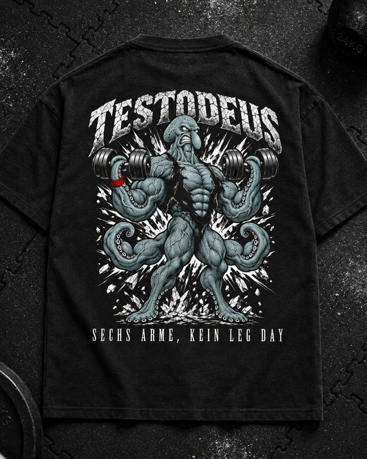 TESTODEUS Oversized Shirt schwarz - Flat-Lay Produktfoto auf Gym-Gummimatte